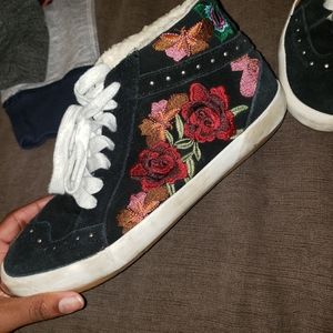 A pair of Sneakers with fur on the insides